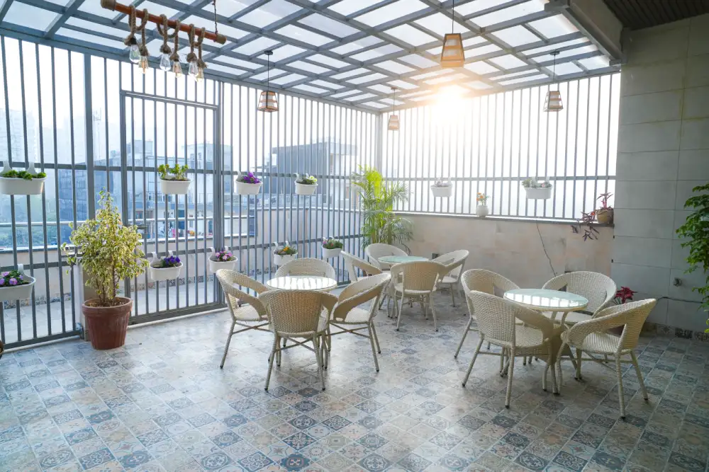 Sunlit terrace seating area with plants at Panaah Rehabilitation Centre